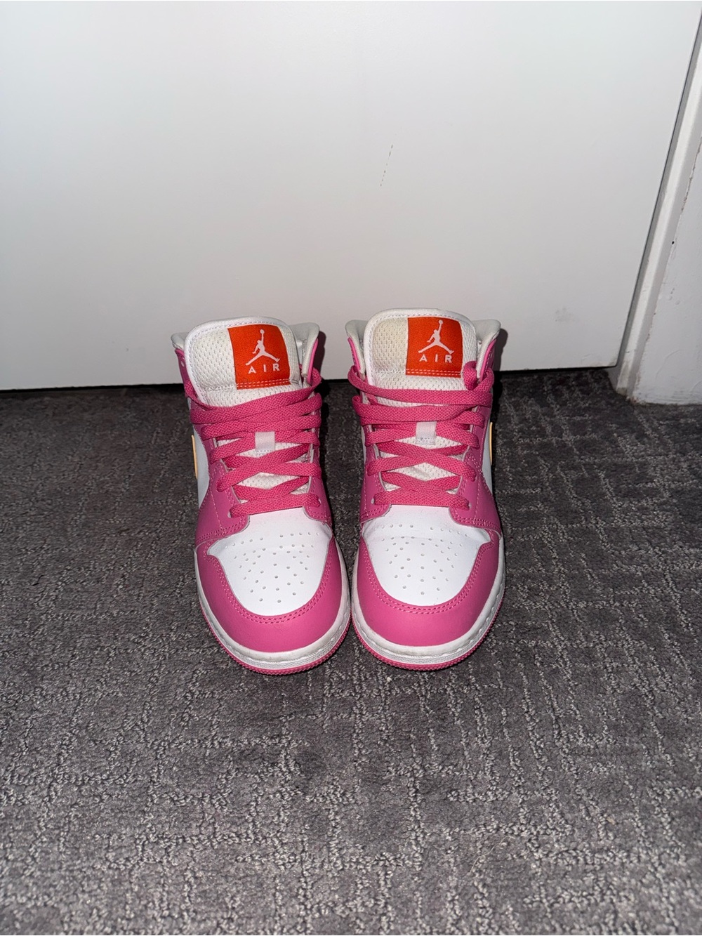 Jordan Pink and White High-Top Sneakers with Orange Tongue Logo